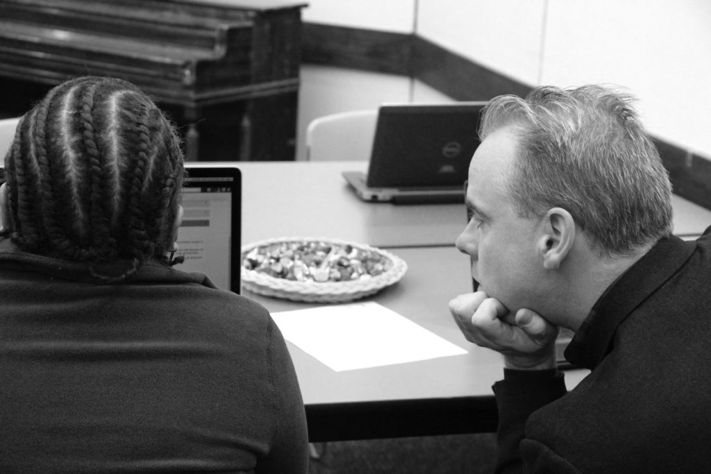 Daniel X. O’Neil observes a tester with piano and candy in background.